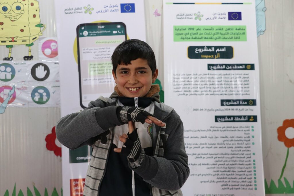 Walid (11) lächelt in die Kamera
